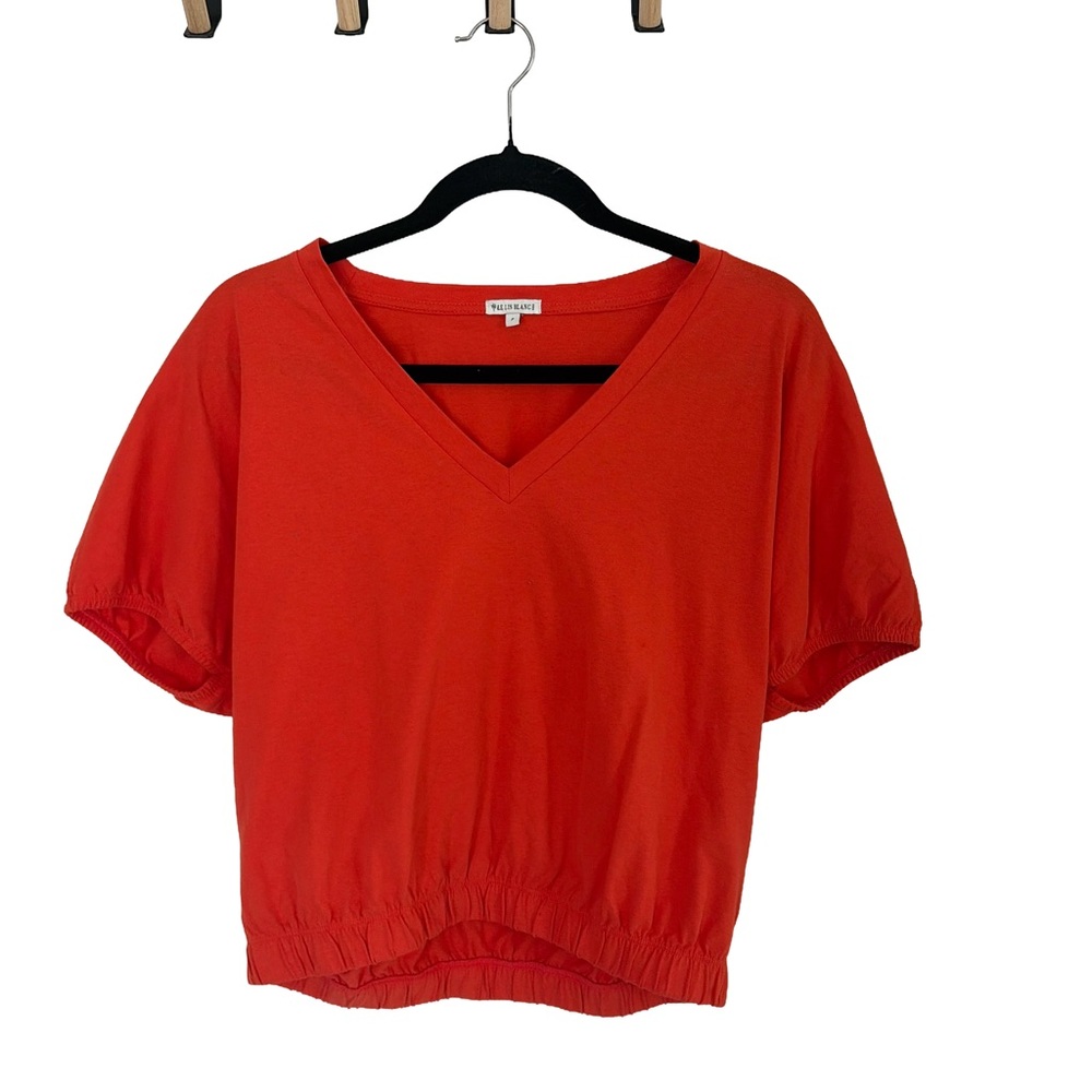 Orange cropped v neckβ top